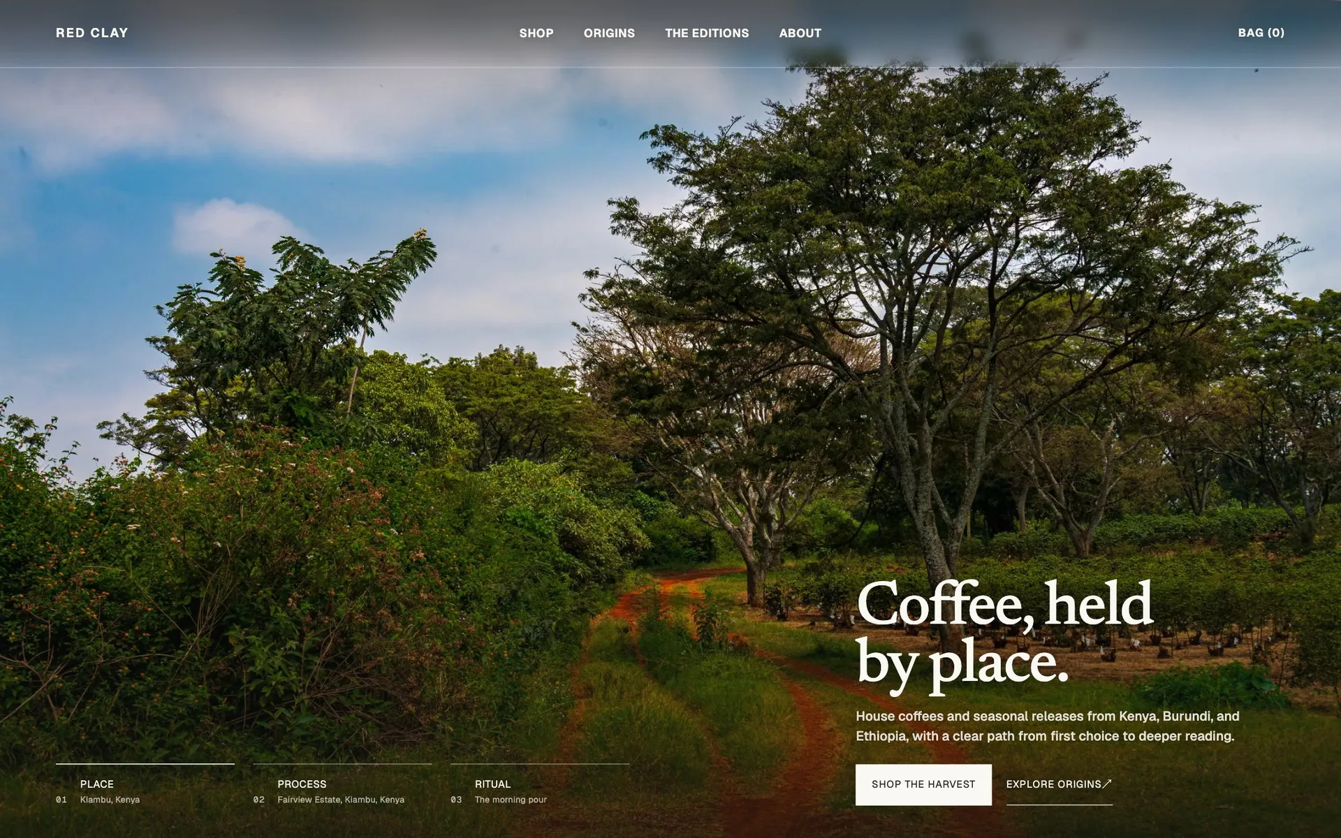 Red Clay home — Coffee, held by place, over a Kiambu dirt road